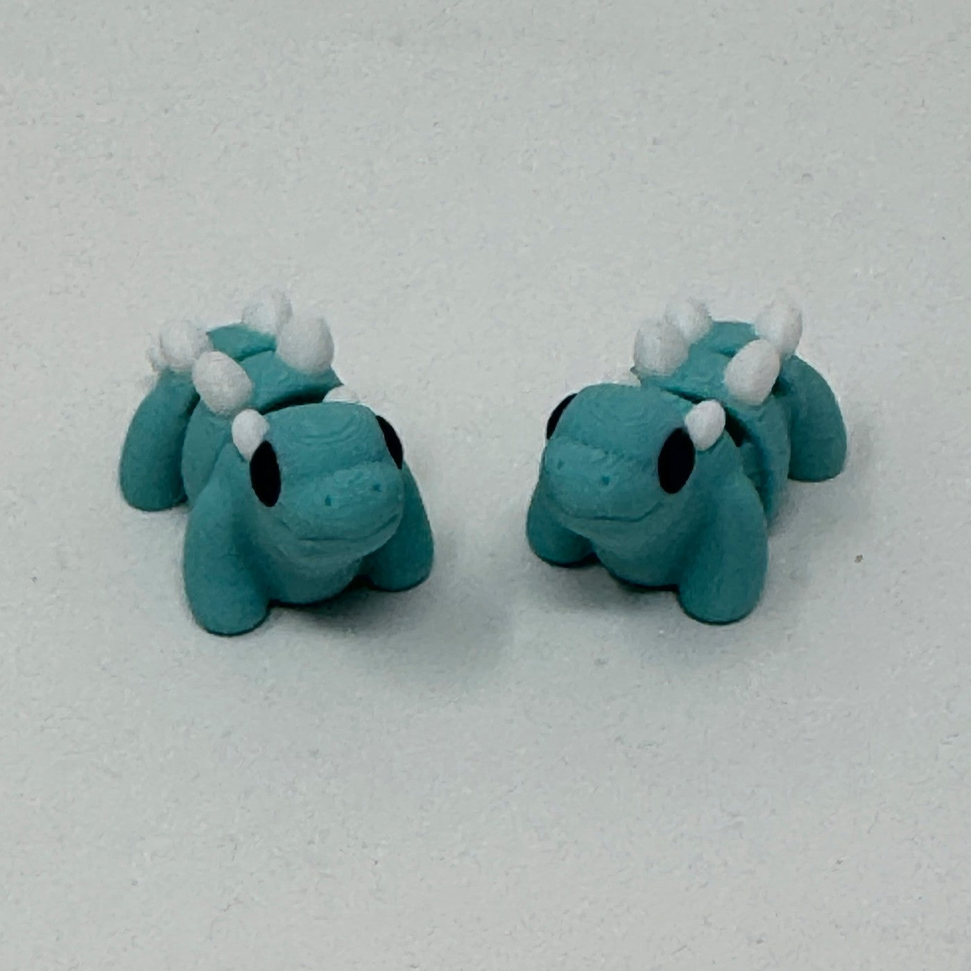 Teal stegosaurus